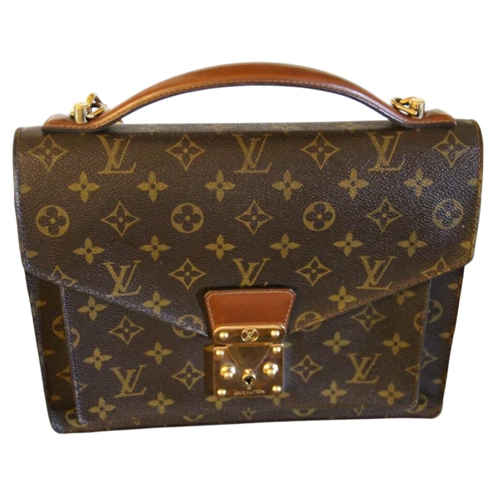 Sac cartable Louis Vuitton Monceau 28 cm en toile Monogram avec serrure S en laiton doré et bandoulière en cuir